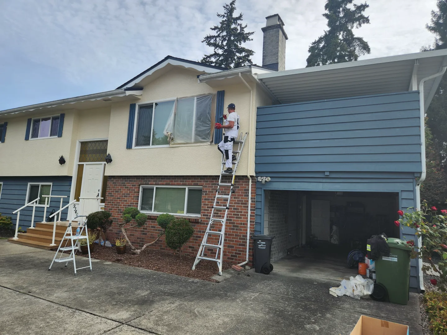Exterior house painting in progress by VV Renovation in Greater Vancouver