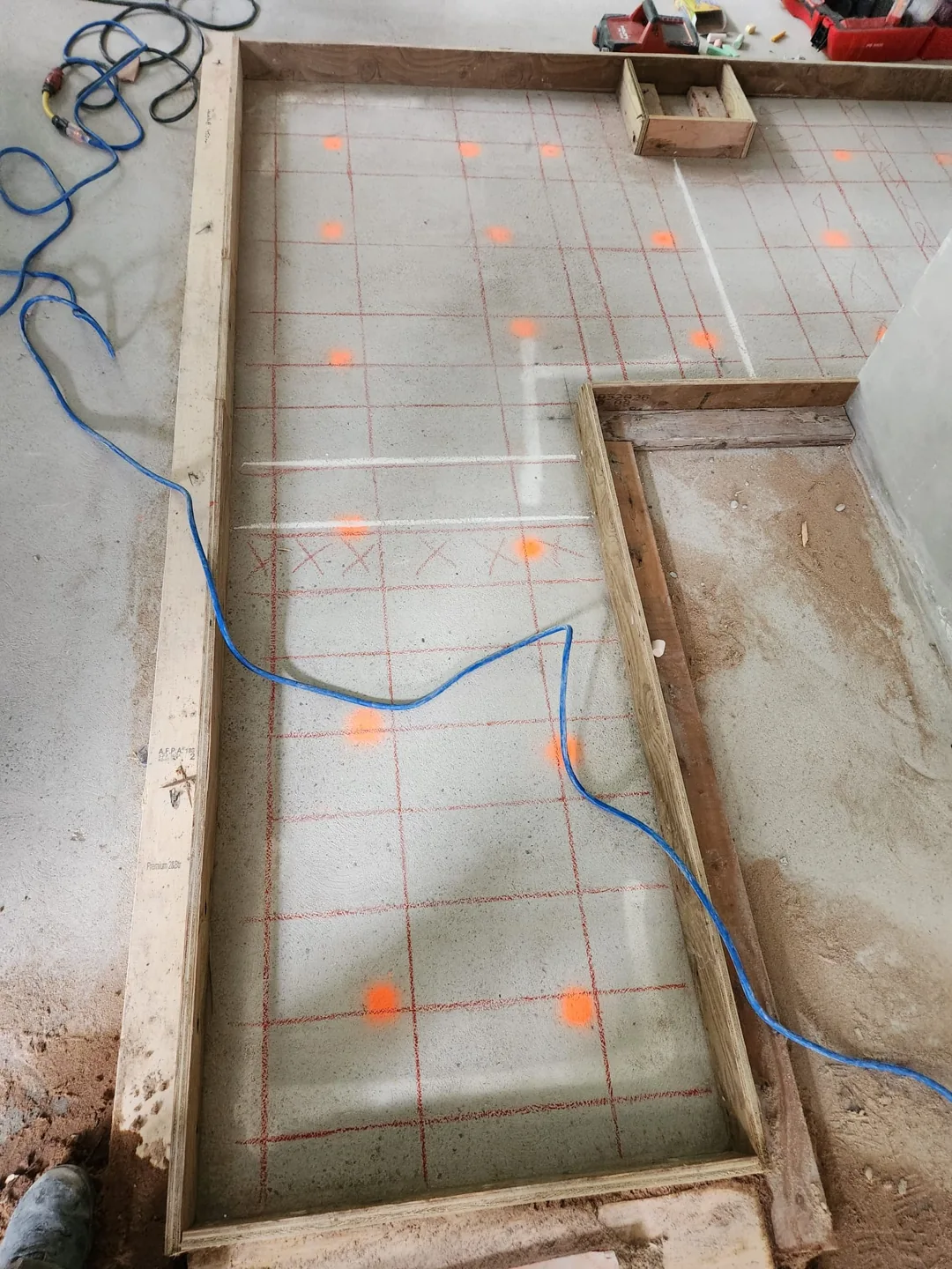 Concrete slab with a scan grid and orange surface markings