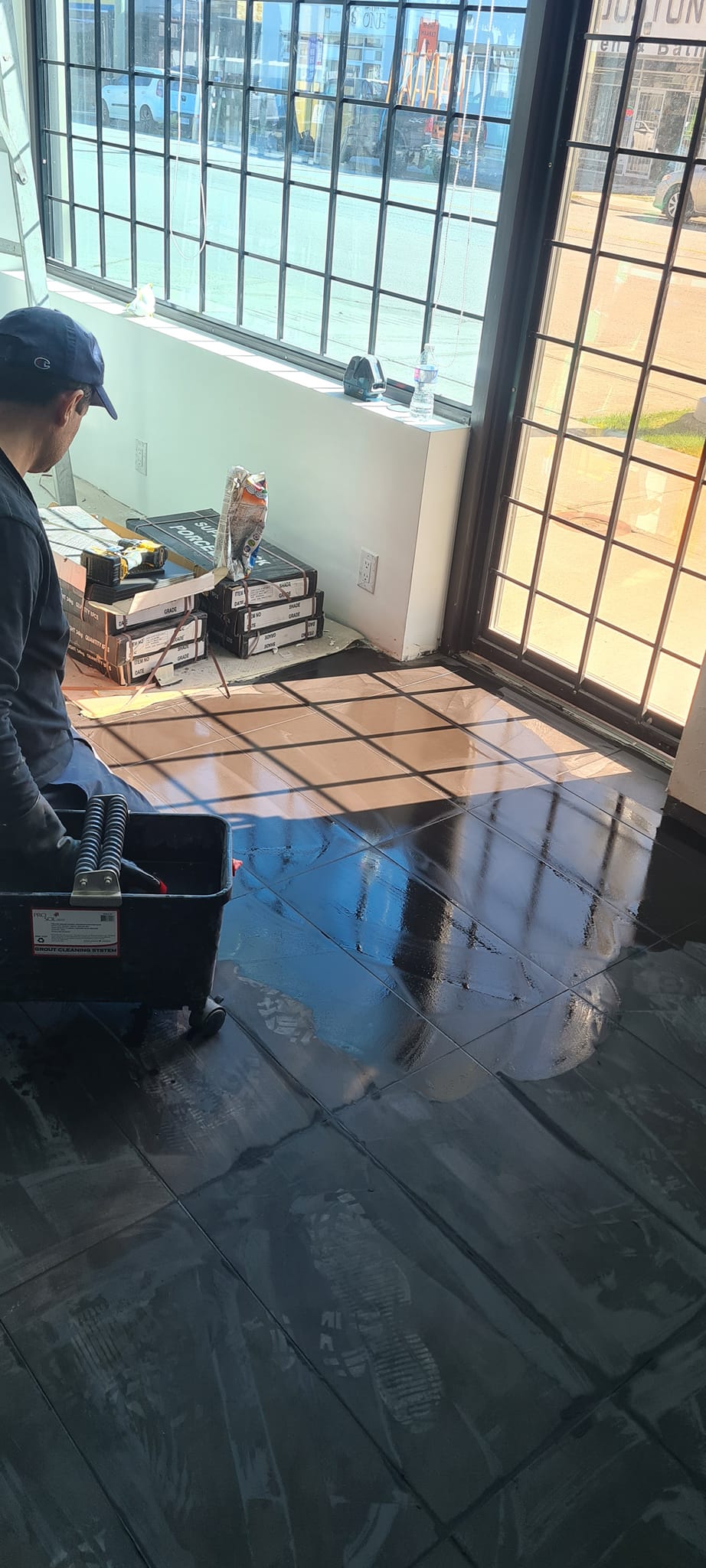 Floor preparation in a sunlit commercial space