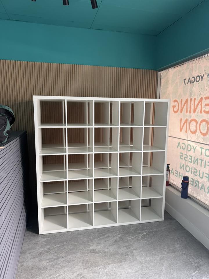 Completed storage shelving installed inside renovated yoga studio in Langley