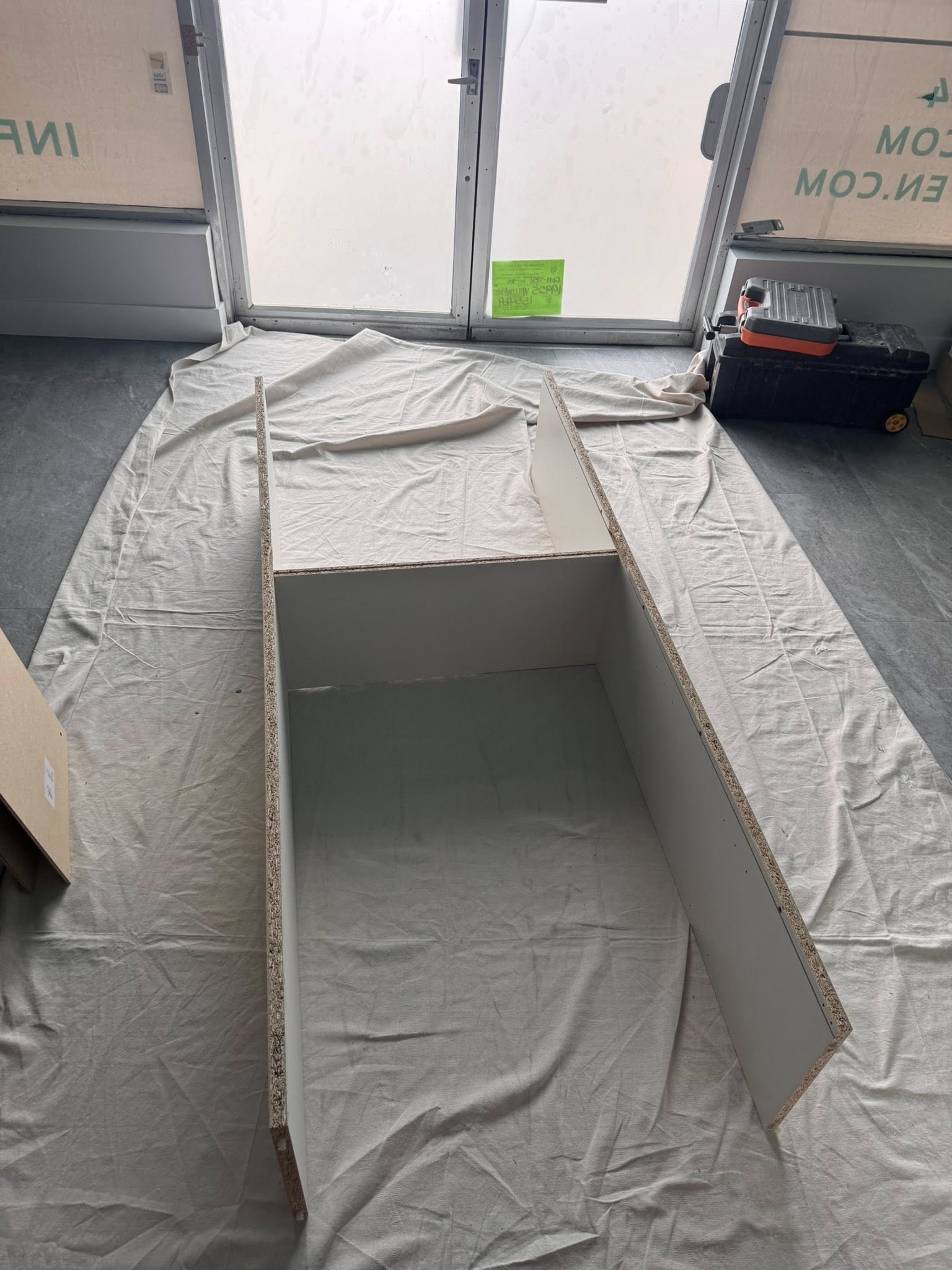 Shelving and storage components being assembled during commercial yoga studio renovation in Langley